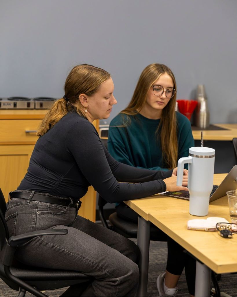 Adult helping student