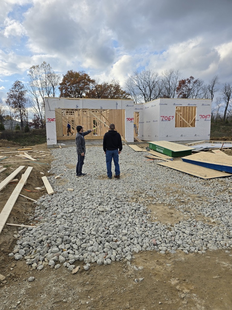Student and  Builder on  residential home site