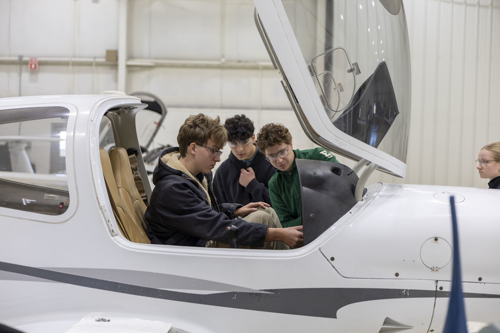 Students check out an airplane cockpit