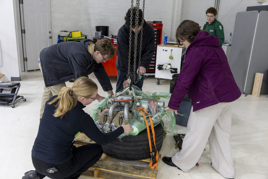 Students get an up close look at an airplane engine