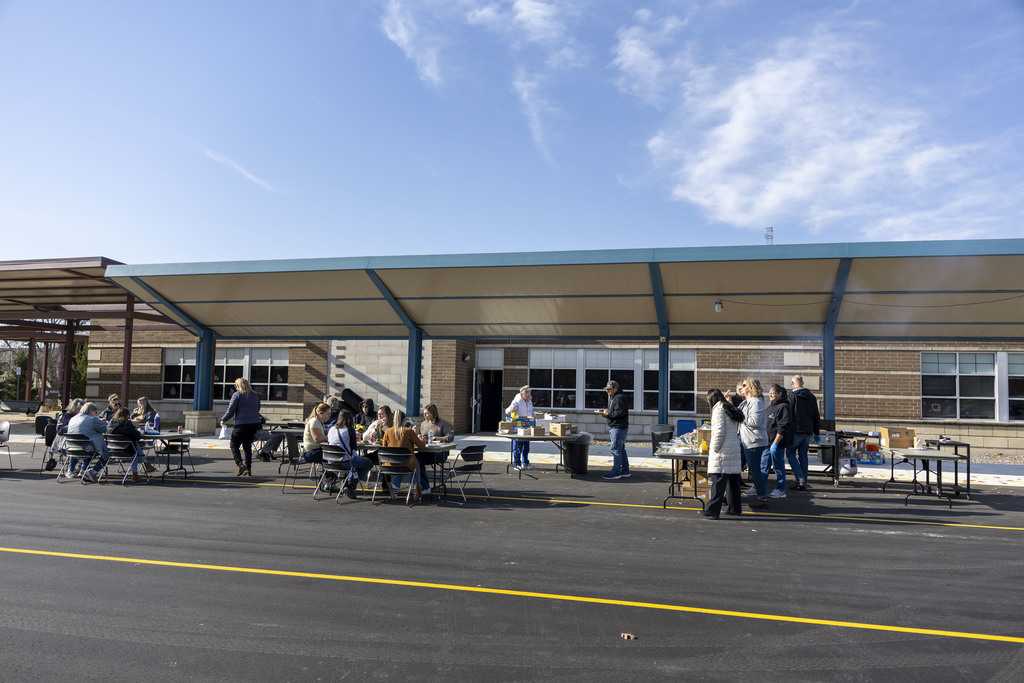 Grill stations and tables with staff eating in the bus lanes.