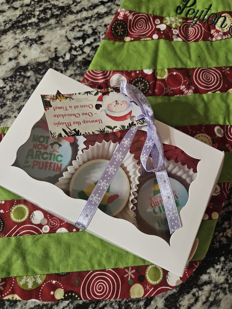 Chocolate Covered Oreos with a festive design.   