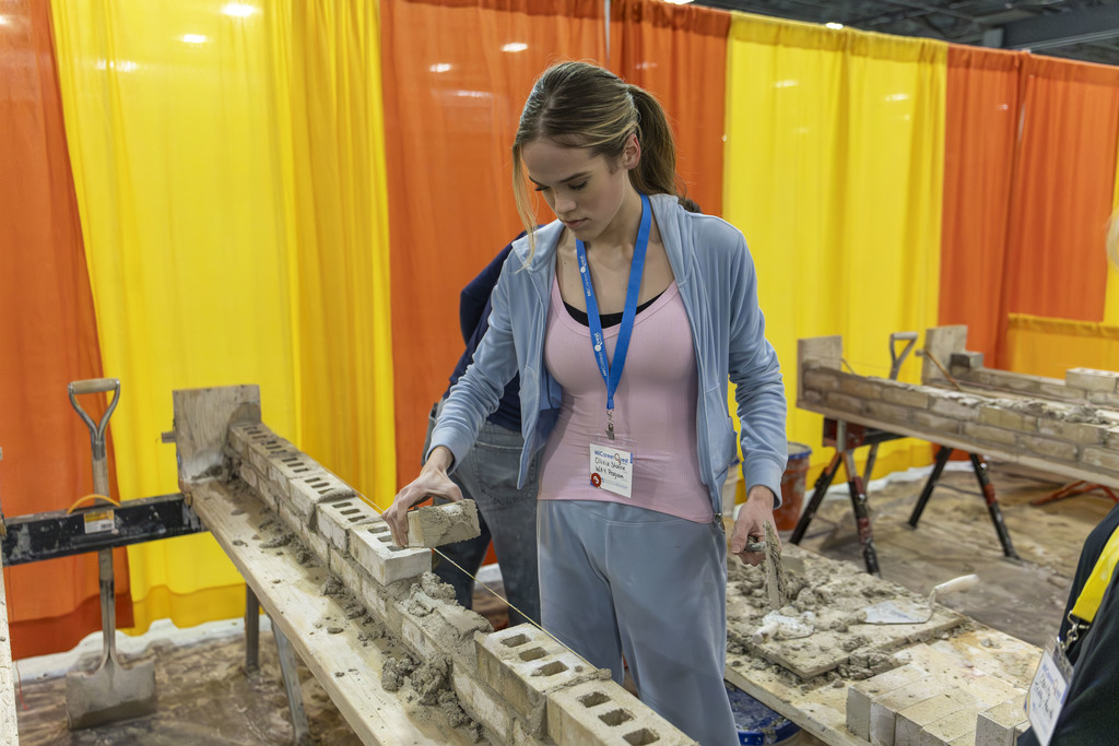 Student trying her hand at masonry