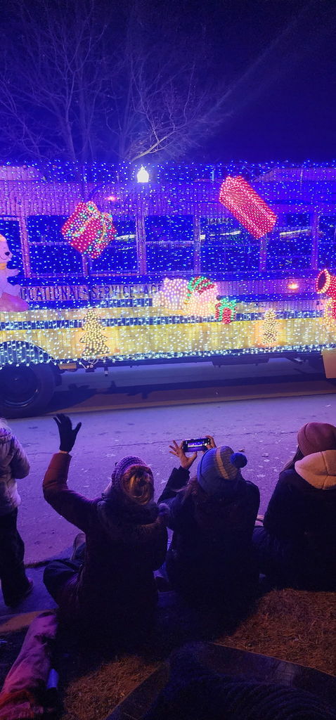 LESA bus decorated and bringing smiles to spectators at the Howell Festival of Lights Parade.
