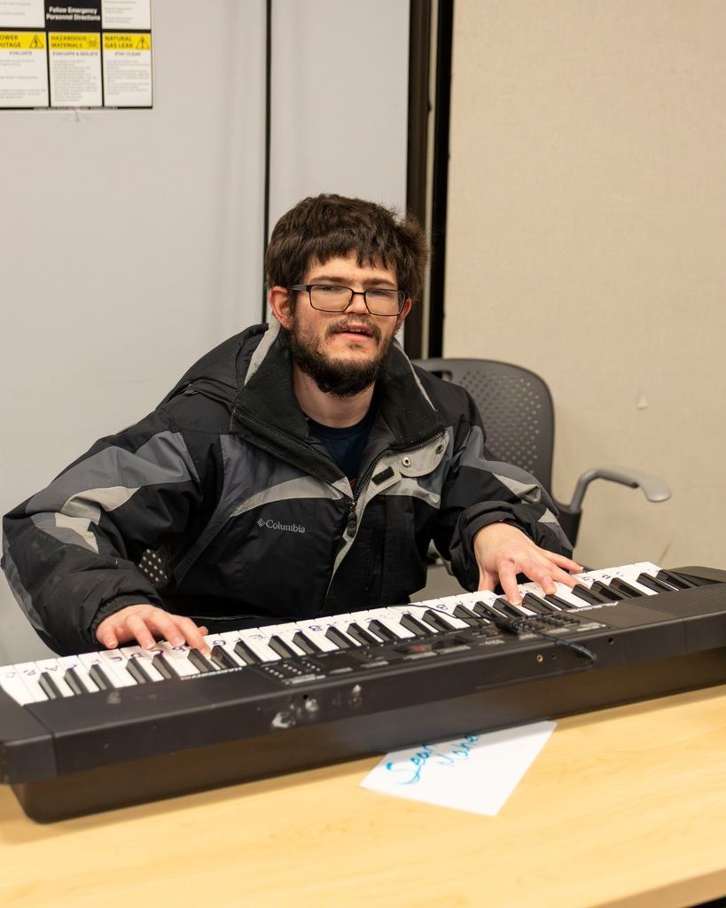 Pathway student plays keyboard