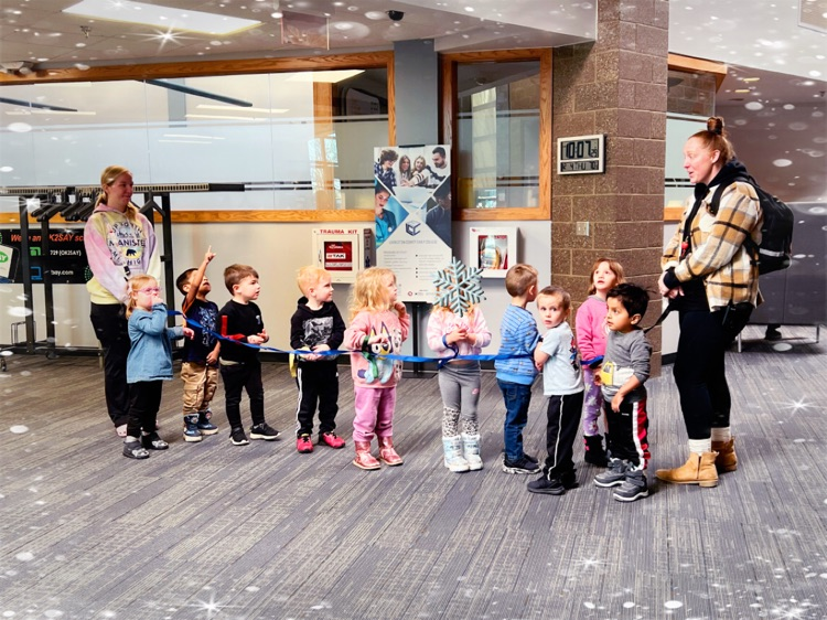 Preschoolers walk the halls with their teachers 