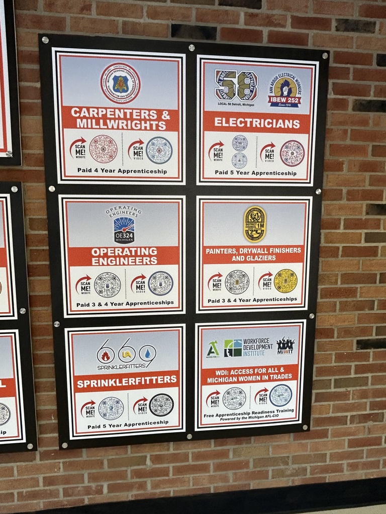 Brick wall with information about various apprenticeships 