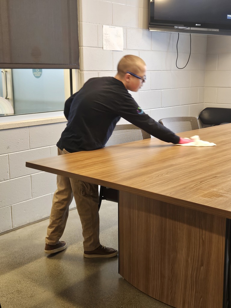 man cleaning table