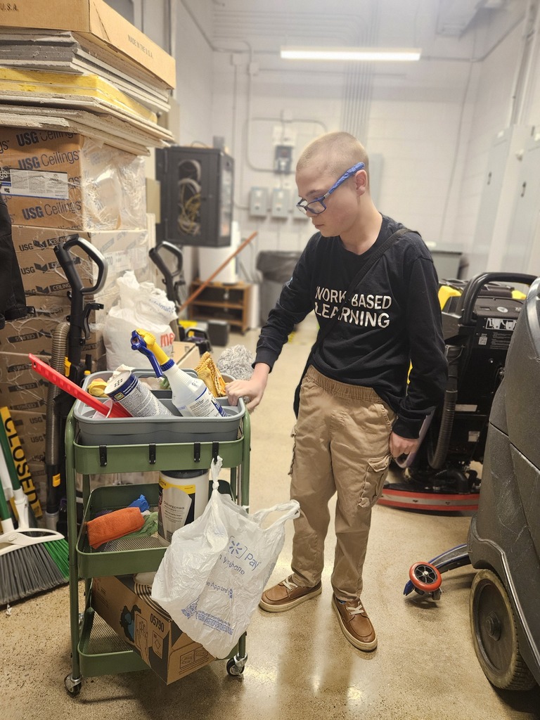 Man next to cleaning cart