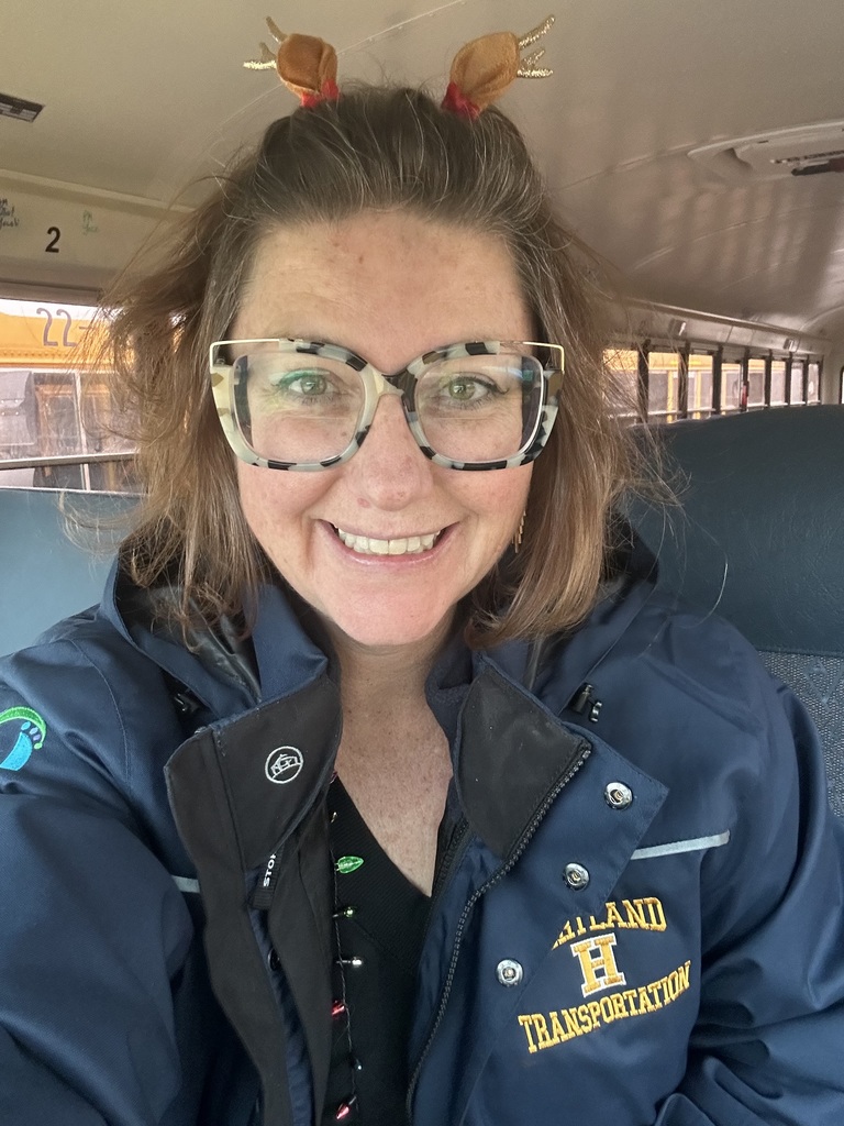 Woman sitting inside a school bus 