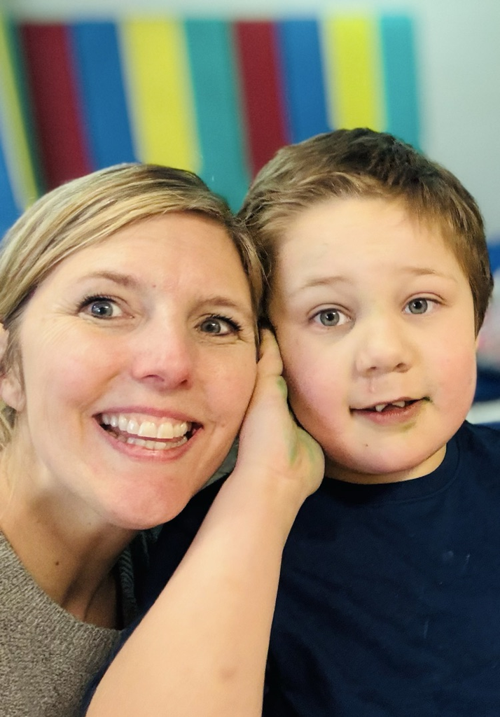 staff next to Bryson for a selfie 