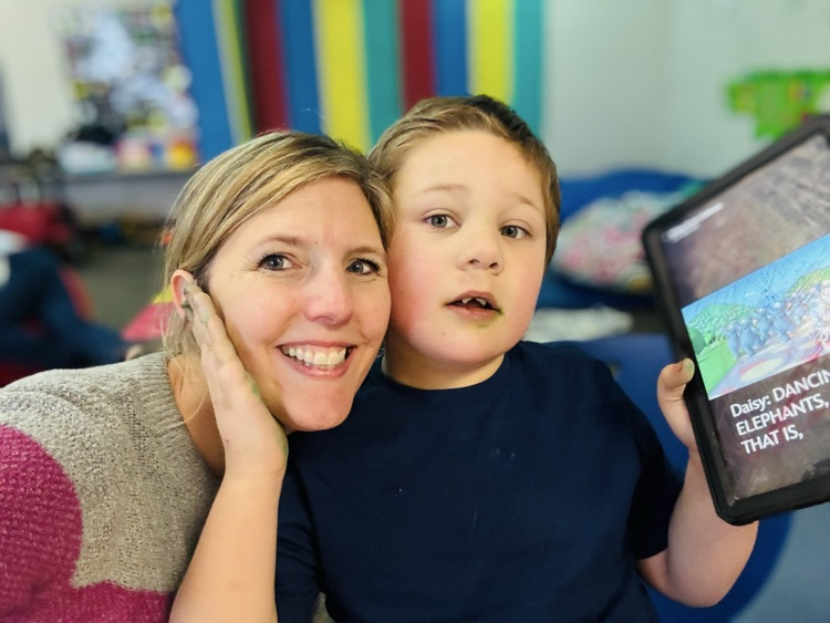 staff next to Bryson for a Selfie 