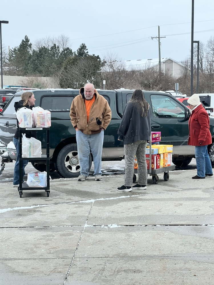 People unloading their truck