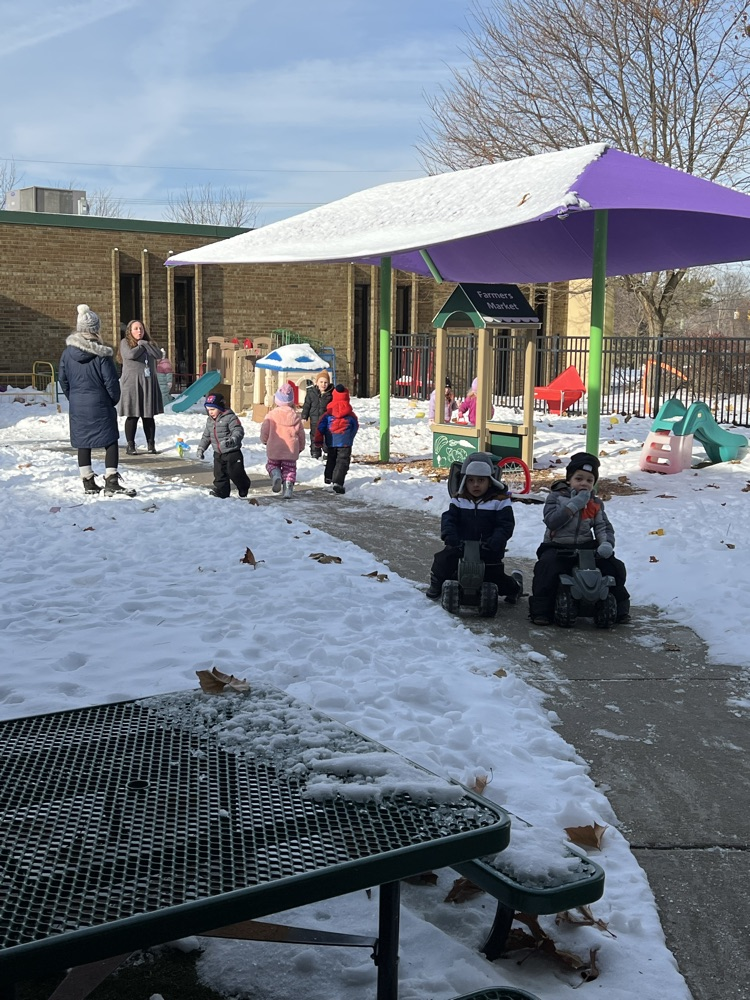 Small children playing in the snow 