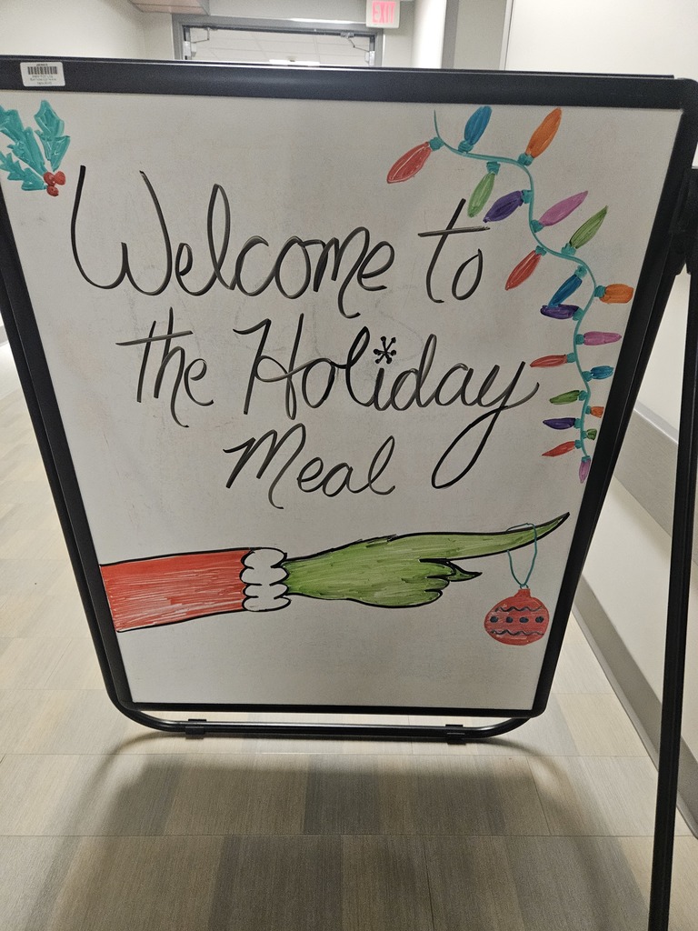 Sign that says "Welcome to the Holiday Meal"