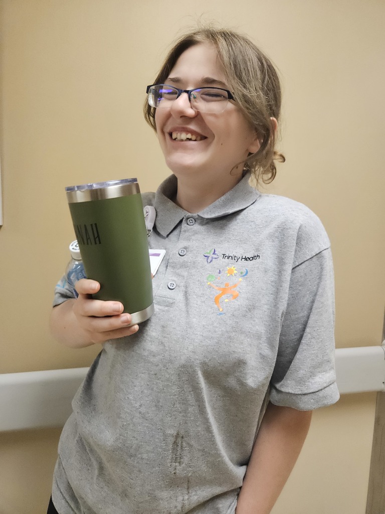 Lady smiling holding a cup