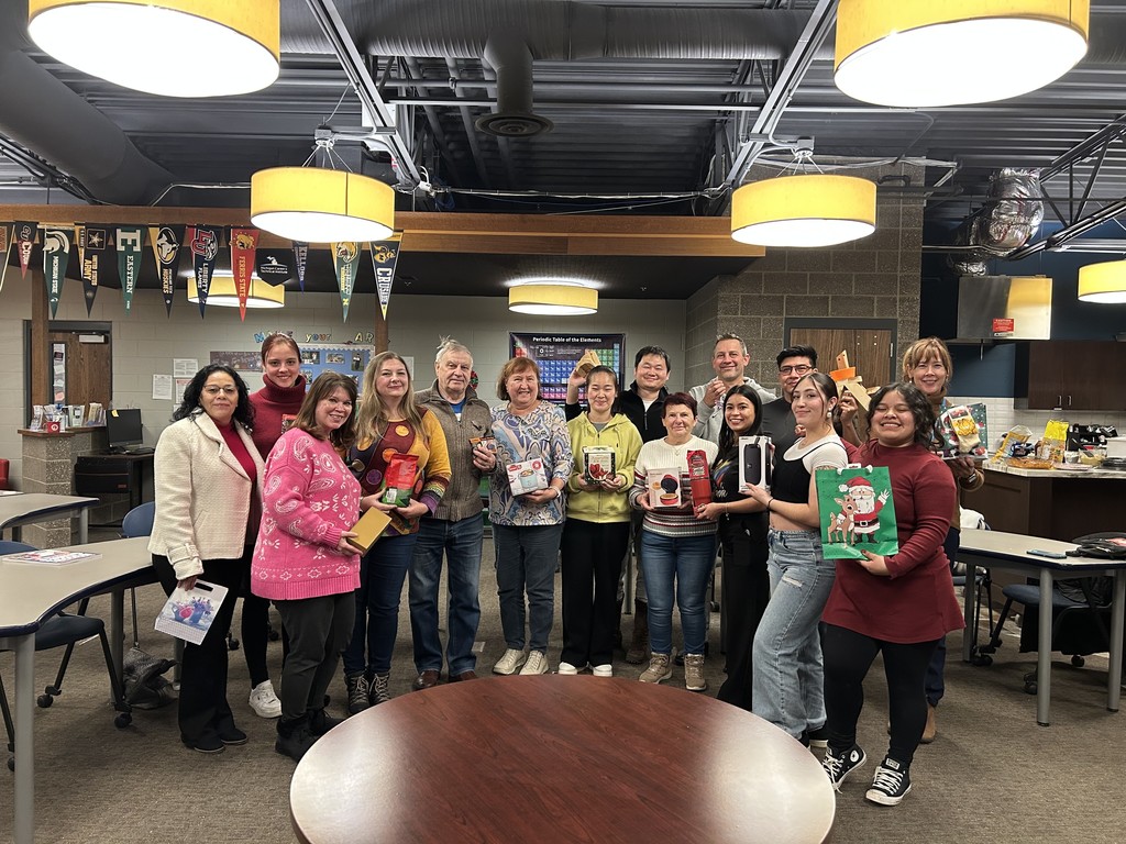 Group of adults gathered to celebrate the holidays