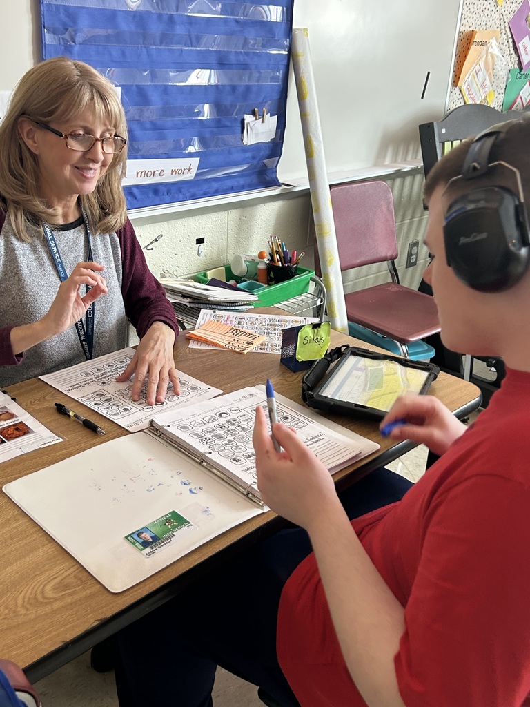 Student working with teacher
