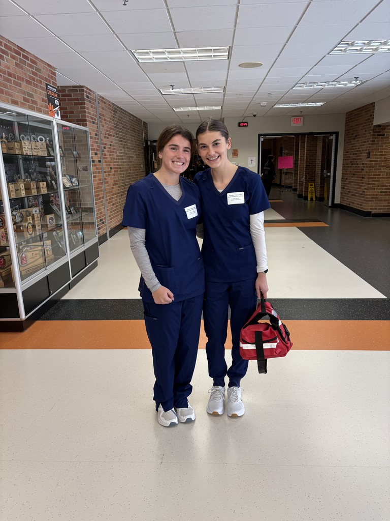 Students wearing medical scrubs