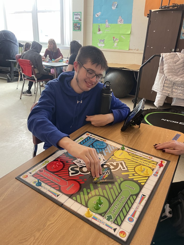 Teen playing the game Sorry.