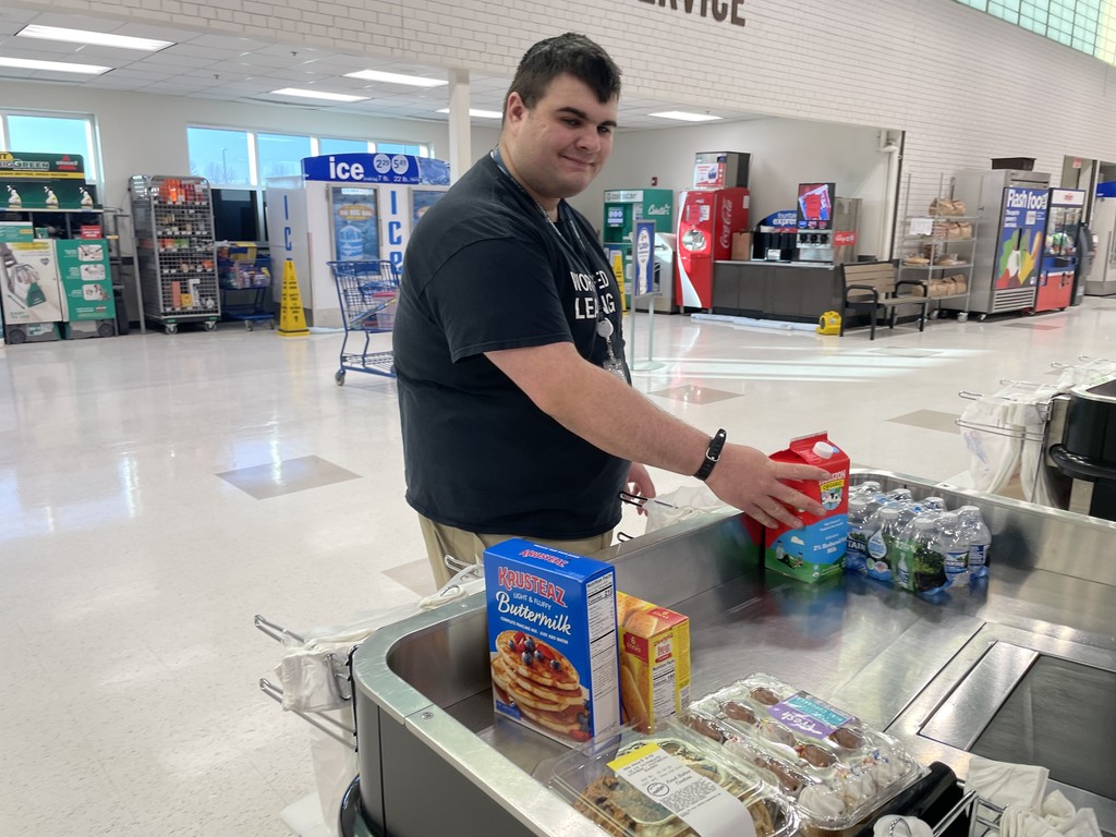 person bagging groceries 