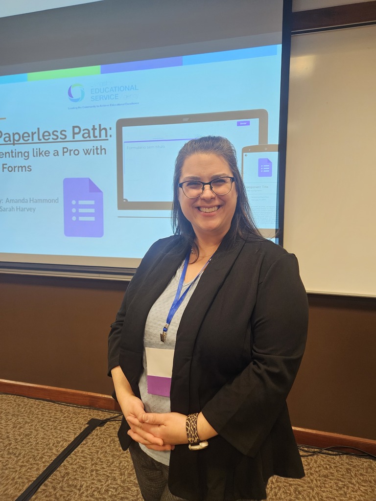 lady with glasses smiling looking at the camera