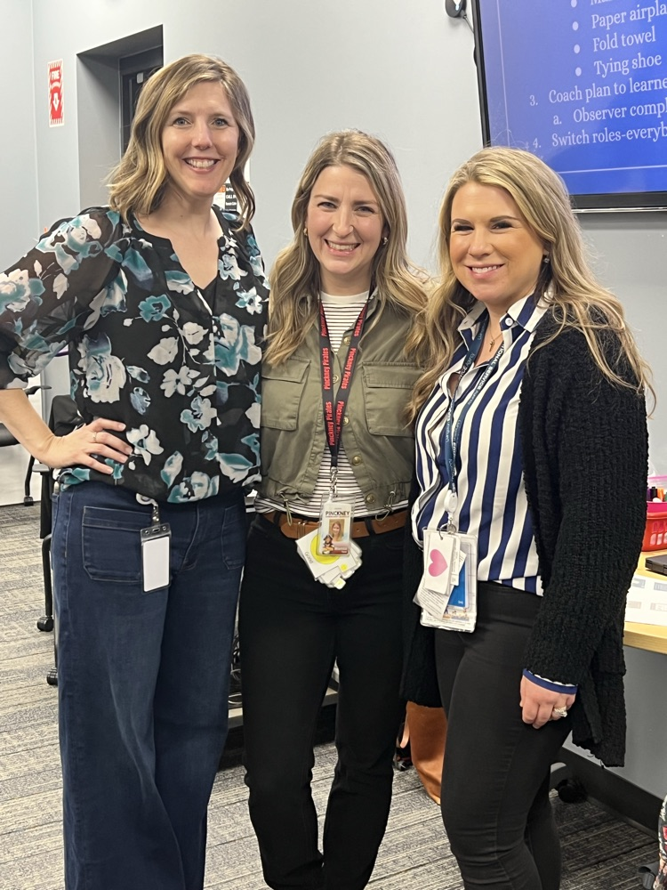 Three ladies pose for a photo