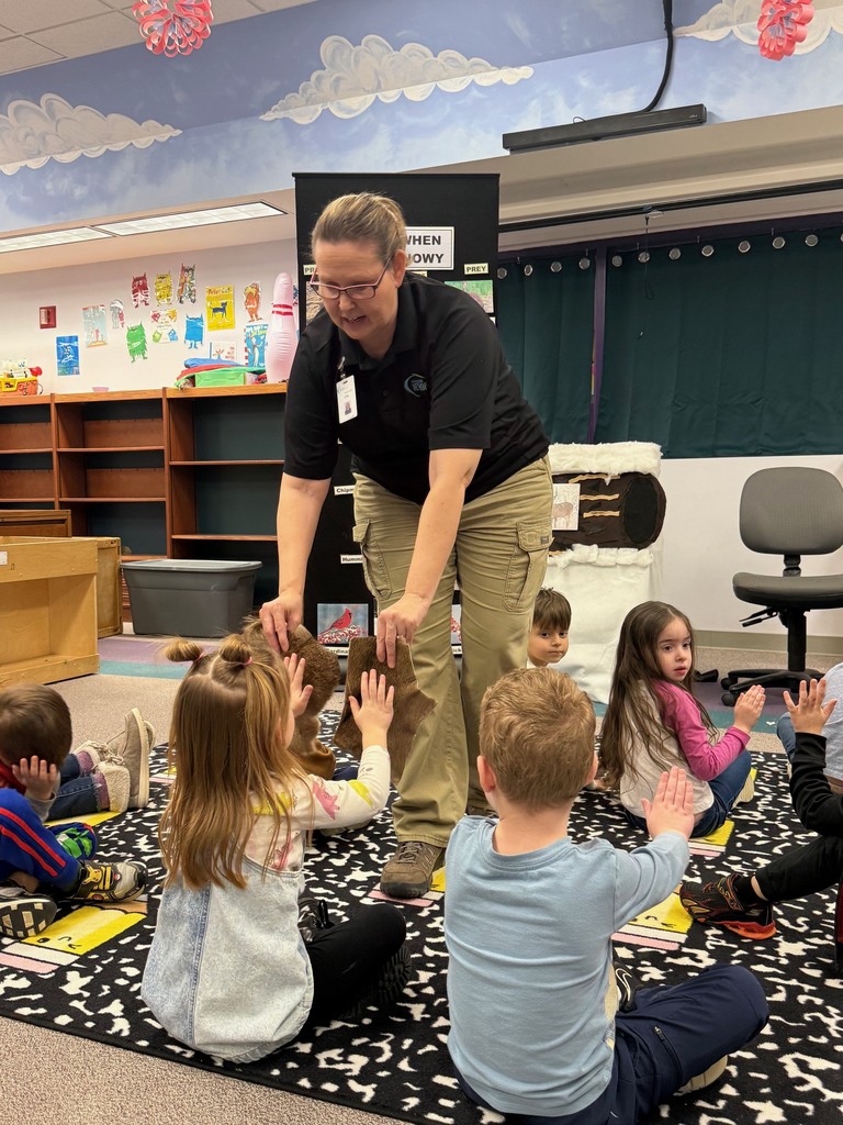 Preschool children participating in a classroom presentation from Kensington Metropark, exploring animal furs.