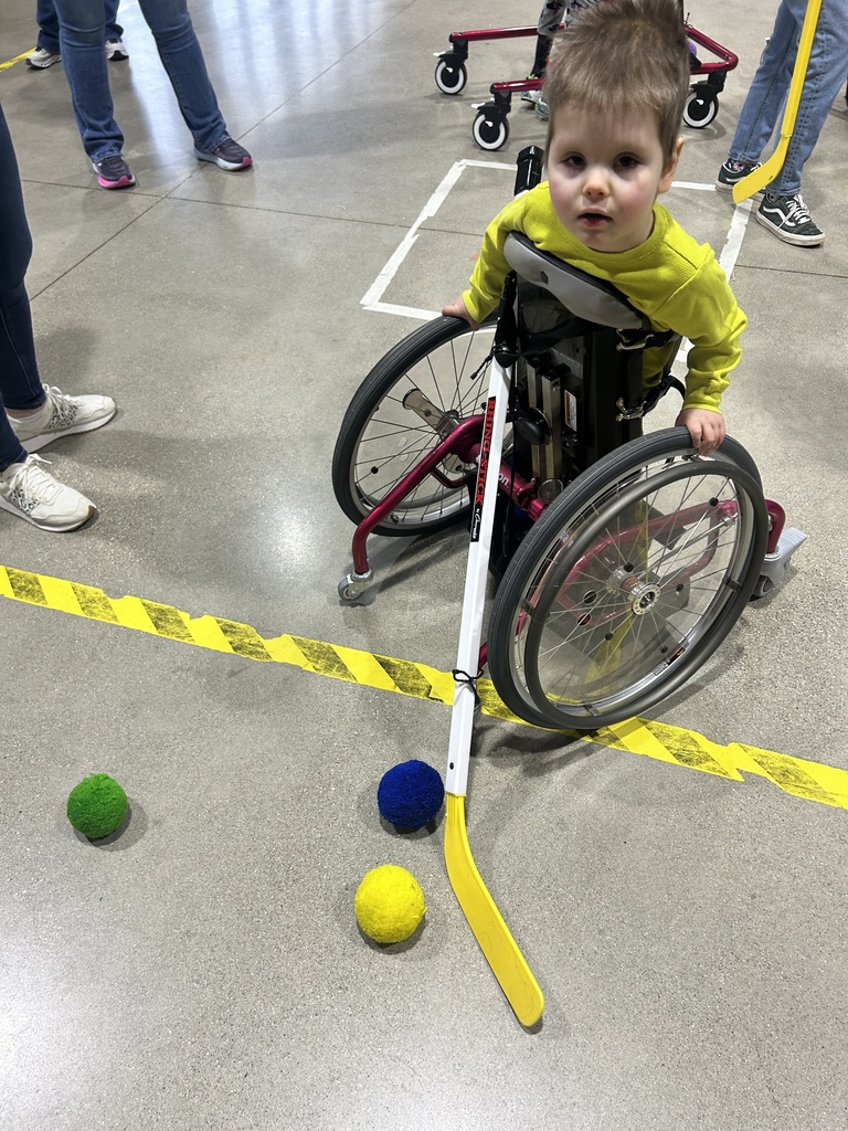 Student playing hockey