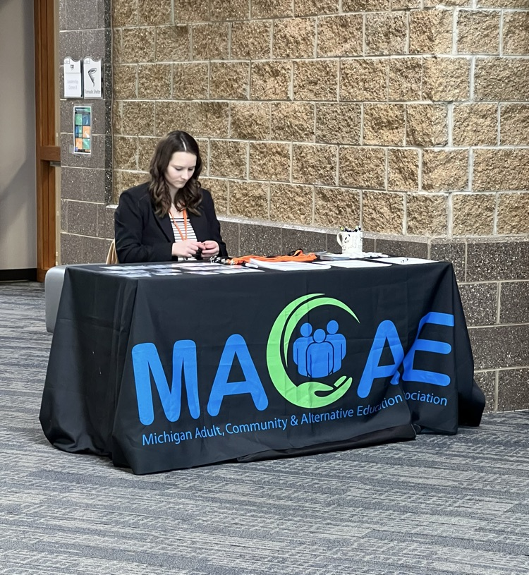 Woman sitting at a welcome desk