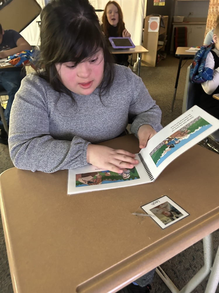 student looking at book