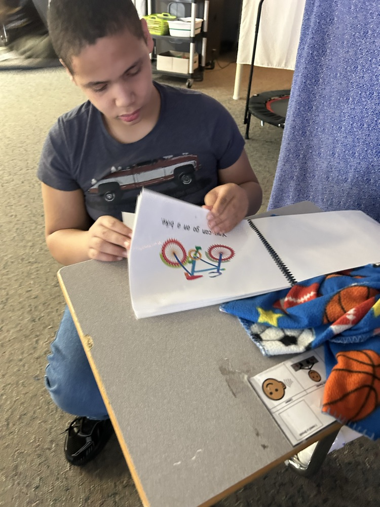 student looking at book