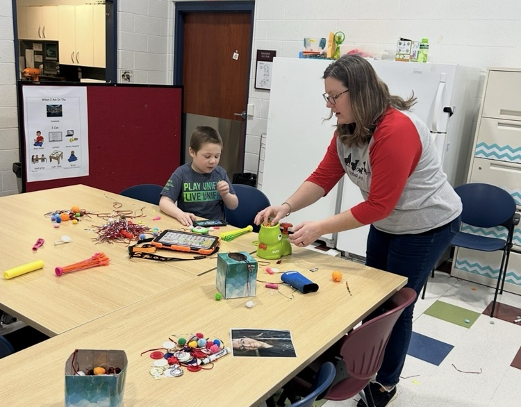 staff working with student 