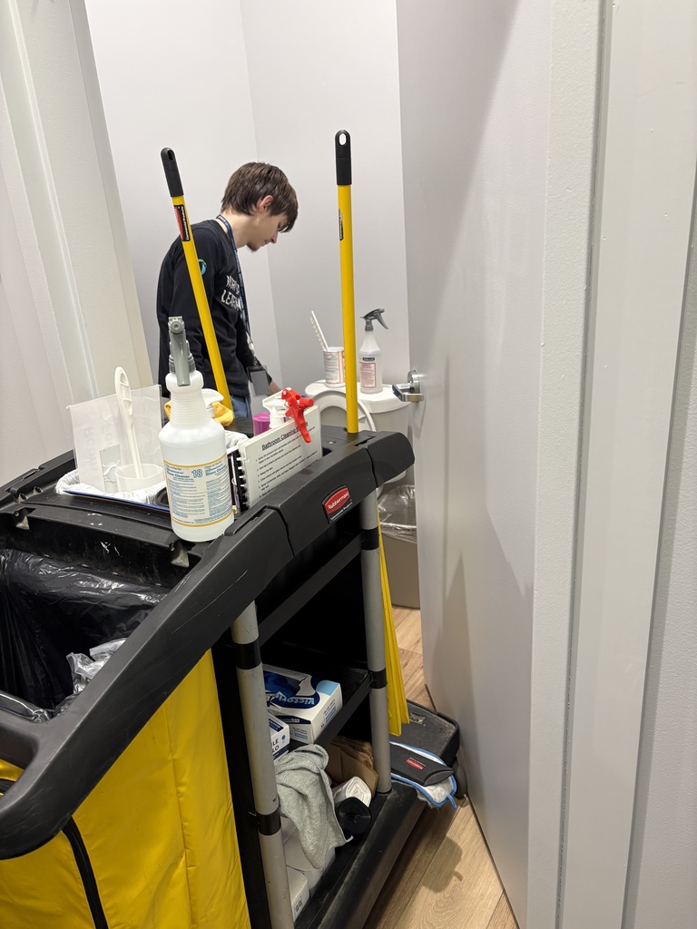 Man cleaning a restroom. 