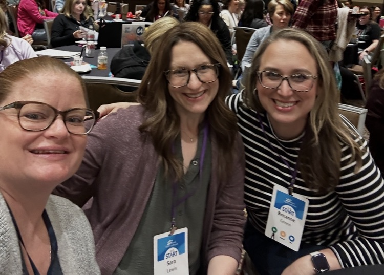 Three woman posing together in a selfie.