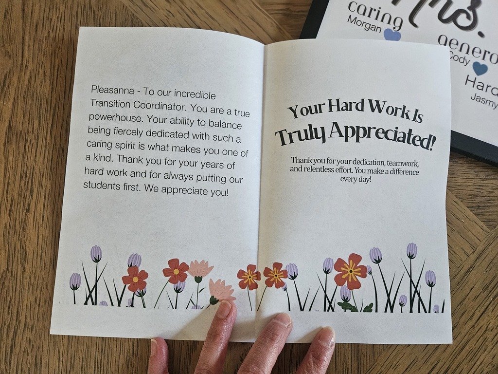 An open greeting card addressed to Pleasanna, an "incredible Transition Coordinator." The text expresses deep appreciation for her dedication, teamwork, and years of hard work putting students first. The bottom of the card is decorated with a colorful floral illustration.