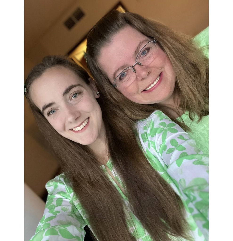 Two ladies smiling.