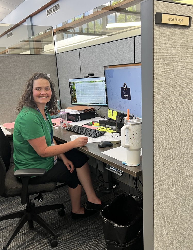 Woman sitting at her desk working on her computer.
