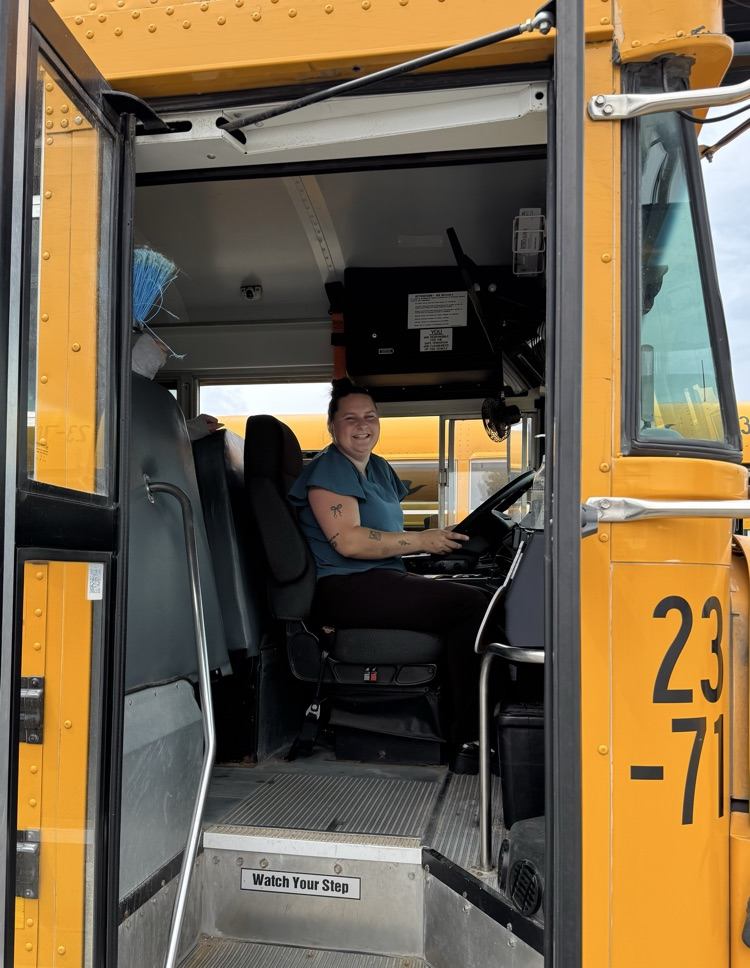 Woman driving a school bus 