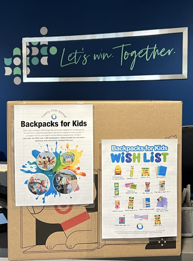 Box sitting on a table with a sign with backpack instructions 