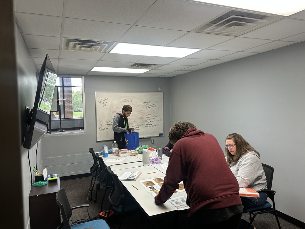 PREP students working with Job Coaches around a conference table