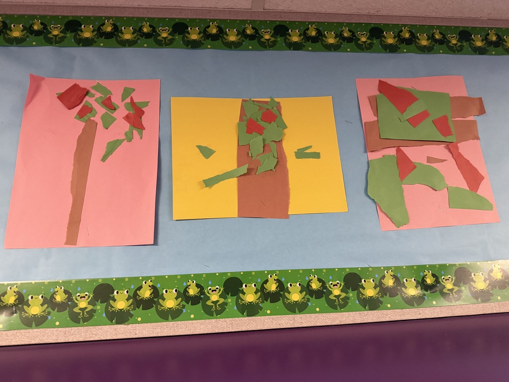 Three colorful tree collages created by preschoolers using torn and layered construction paper.