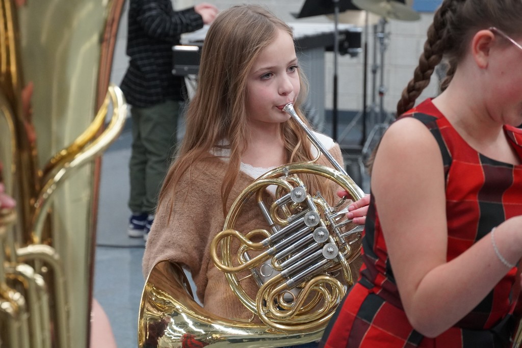 student with french horn