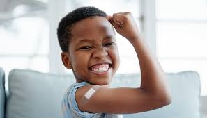 boy flexing muscle