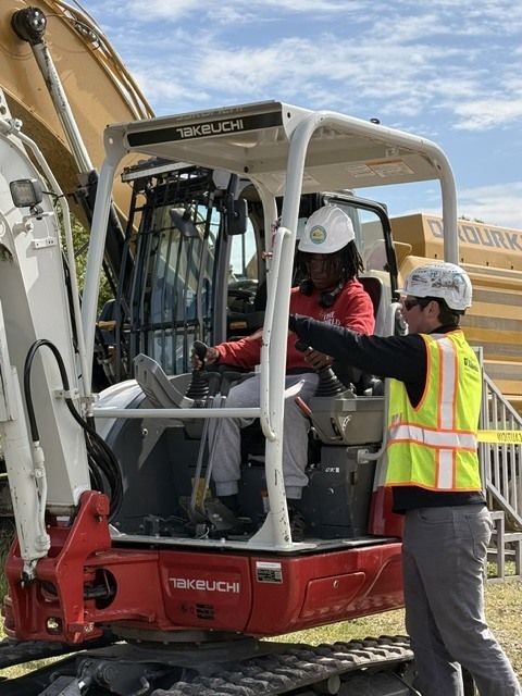 student driving machinery