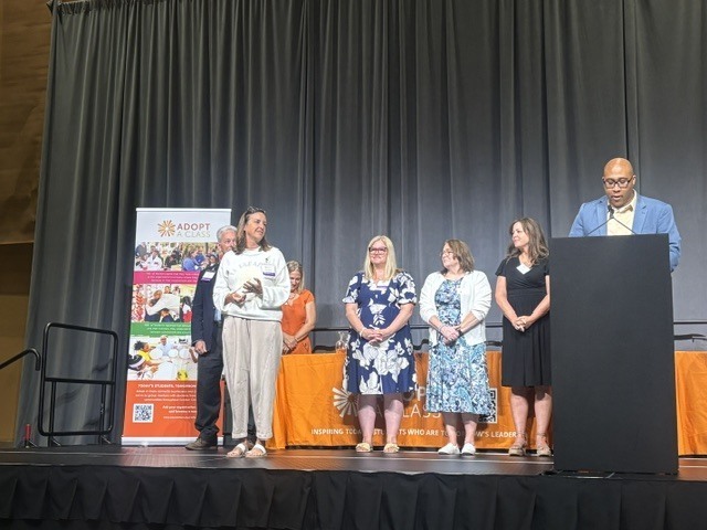 group on stage during awards