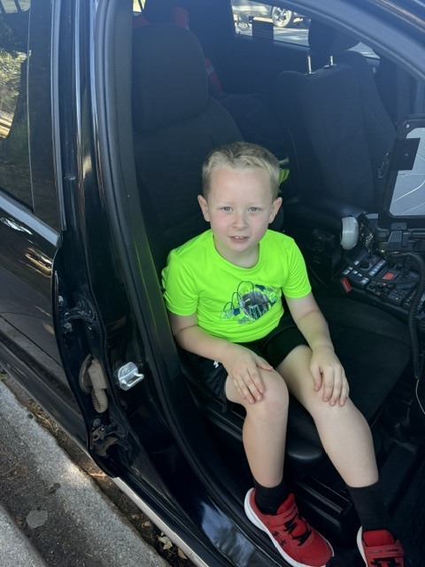 Elementary Student in Patrol Vehicle