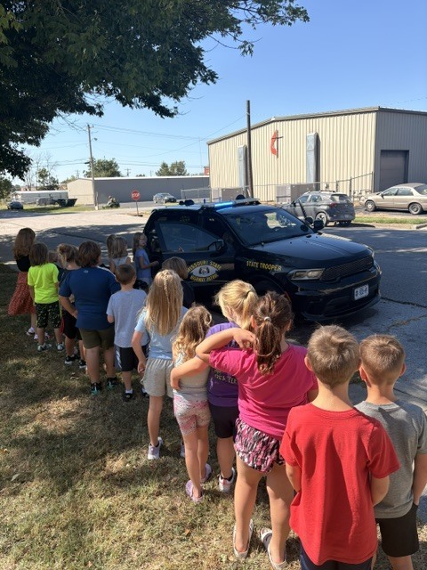 Elementary Students checking out the Patrol Vehicle