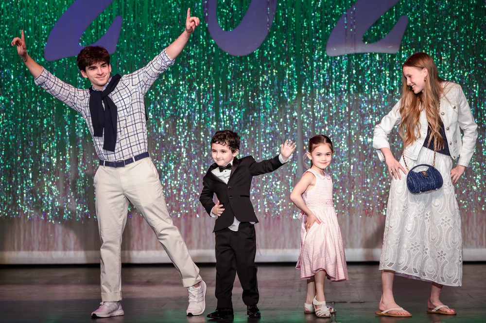 Kindergartners and high school seniors showcase formalwear at the annual fashion show.