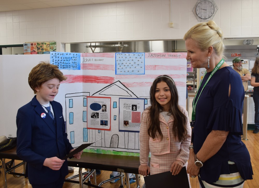Bayville Primary School students Nina Orlowsky as John F. Kennedy and Elaina Linnemeyer as Jacqueline Kennedy presented their project to Superintendent of Schools Dr. Kristen Turnow.